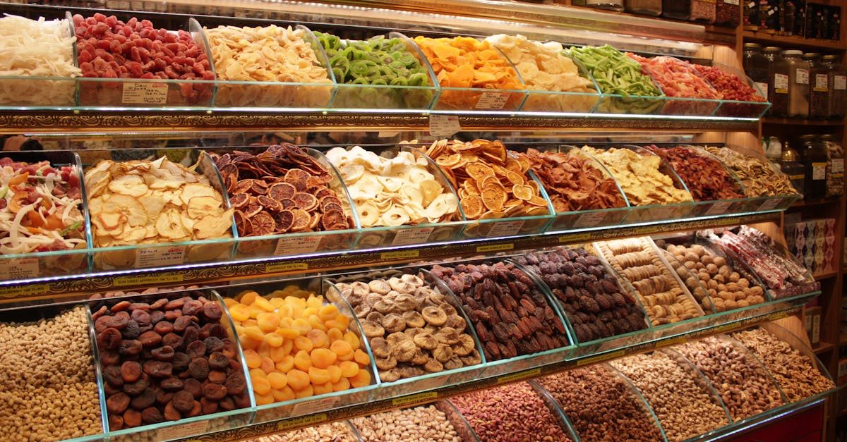 Colorful display of dried fruits and nuts in a market. Perfect for food or lifestyle topics.